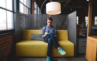 man sitting on couch