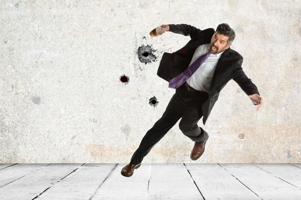 man dodging bullets